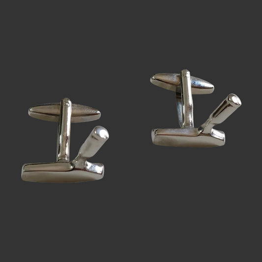Pair of silver cufflinks on a white background