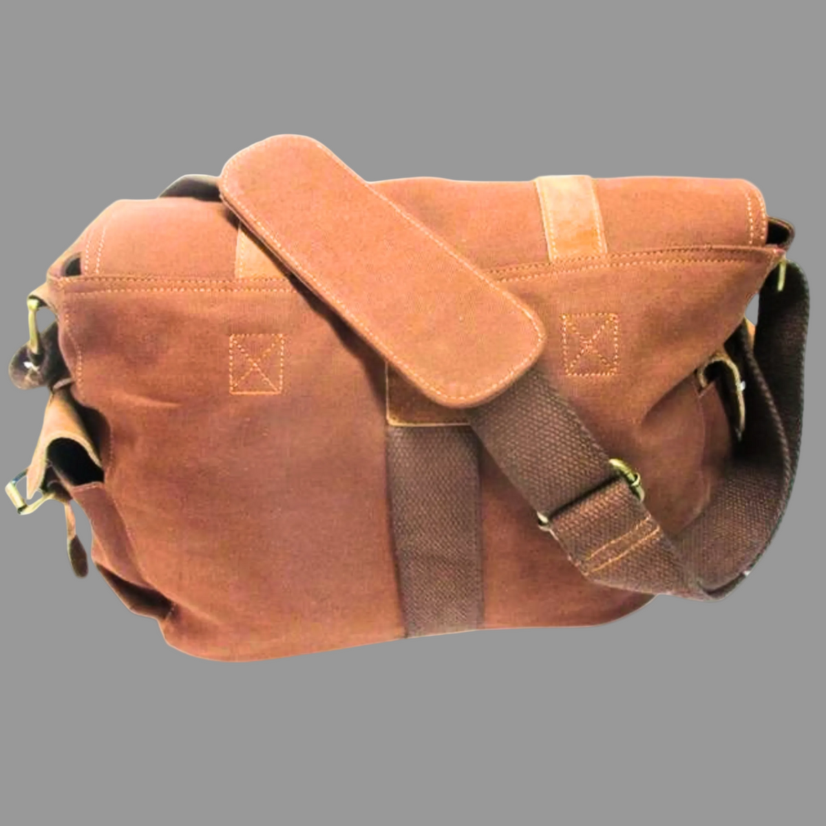 Brown leather bag with a strap on a white background
