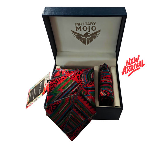Colorful patterned tie in a 'Military Mojo' box with 'New Arrival' text.