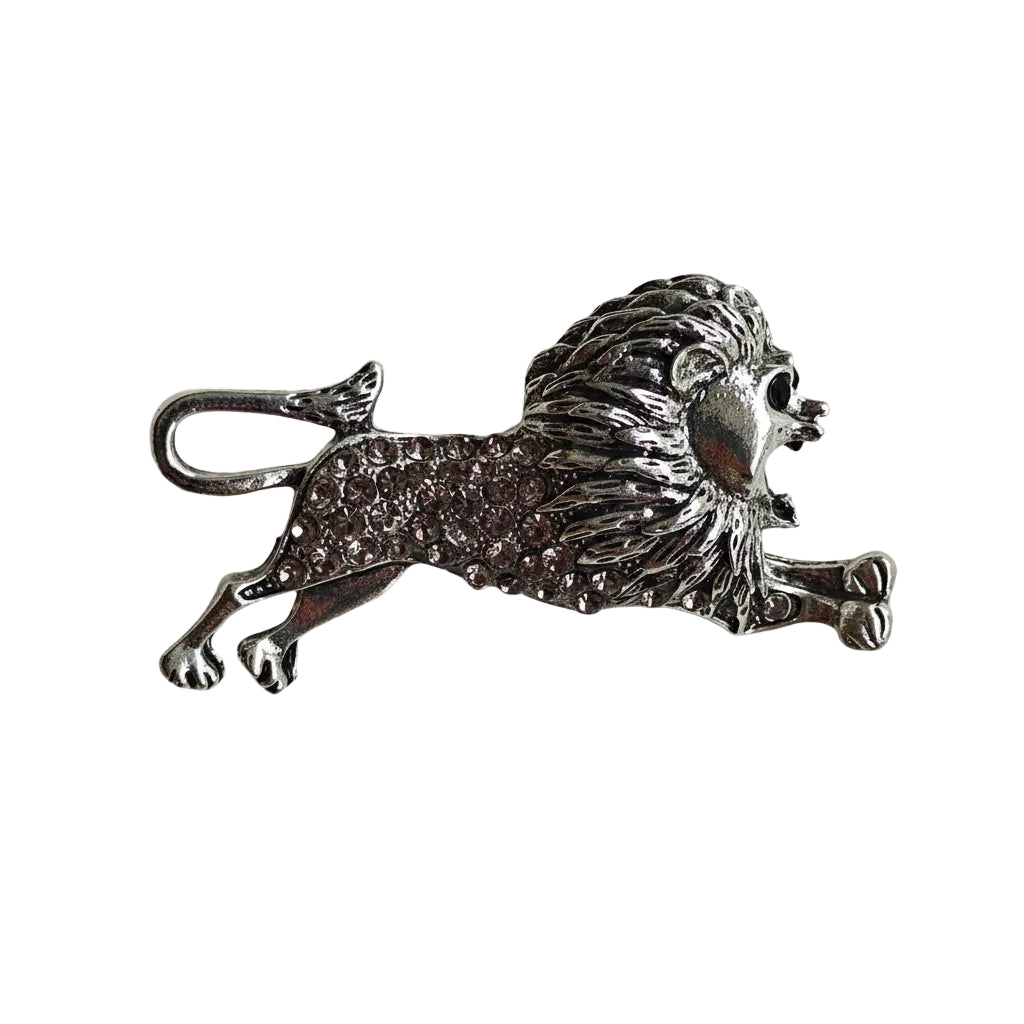 A silver lion-shaped brooch with textured detailing and a small hanging loop, shown on a plain light gray background.