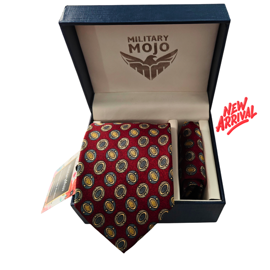 Red patterned tie in a 'Military Mojo' branded box with 'New Arrival' text.