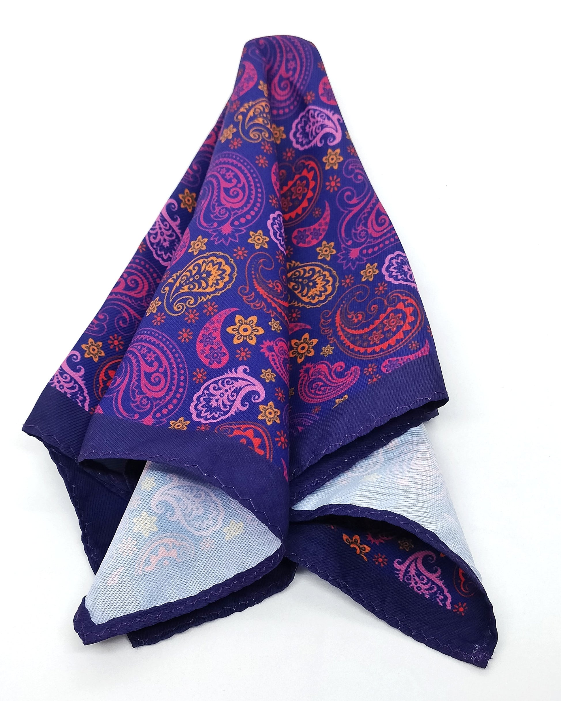 A purple paisley patterned pocket square laid out flat.
