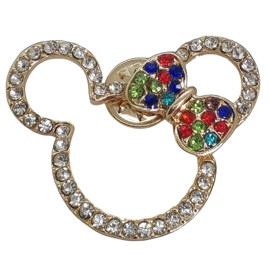 A multicolored crystal-studded brooch in the shape of Mickey Mouse's head silhouette.