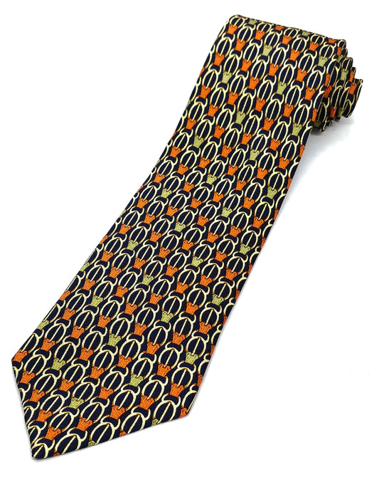 A patterned necktie with a combination of orange, black, and white colors, displayed on a plain background.